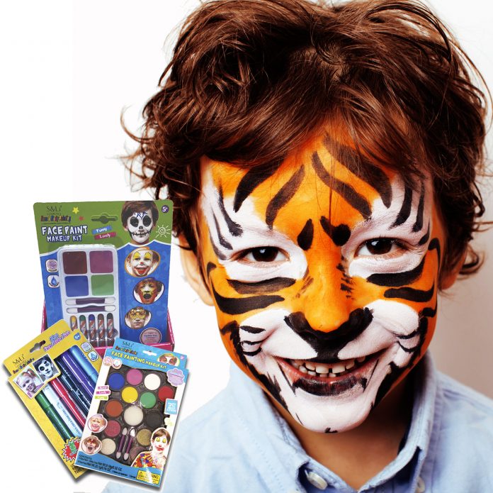 little cute boy with faceart on birthday party close up, little cute tiger