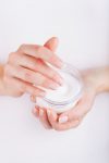 36734796 – woman applying cream on hands