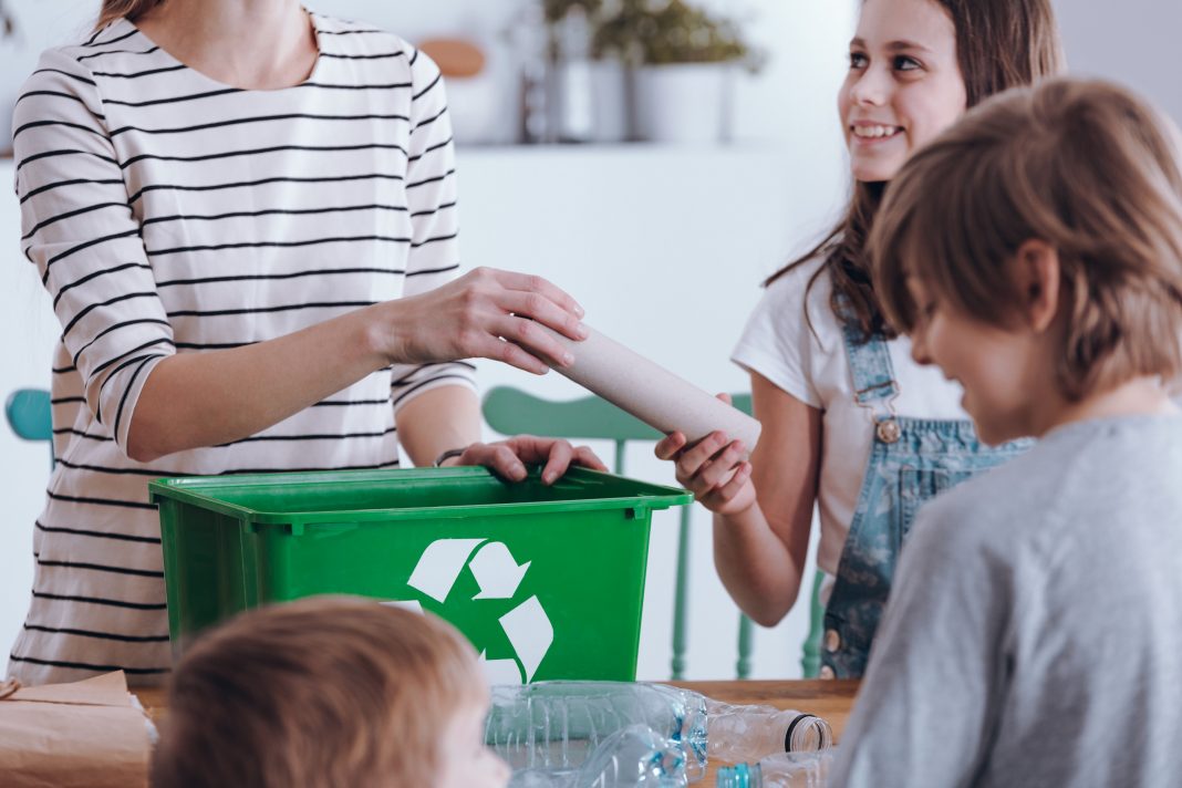 Close-up,Of,Mother,Teaching,Kids,How,To,Segregate,Waste,At